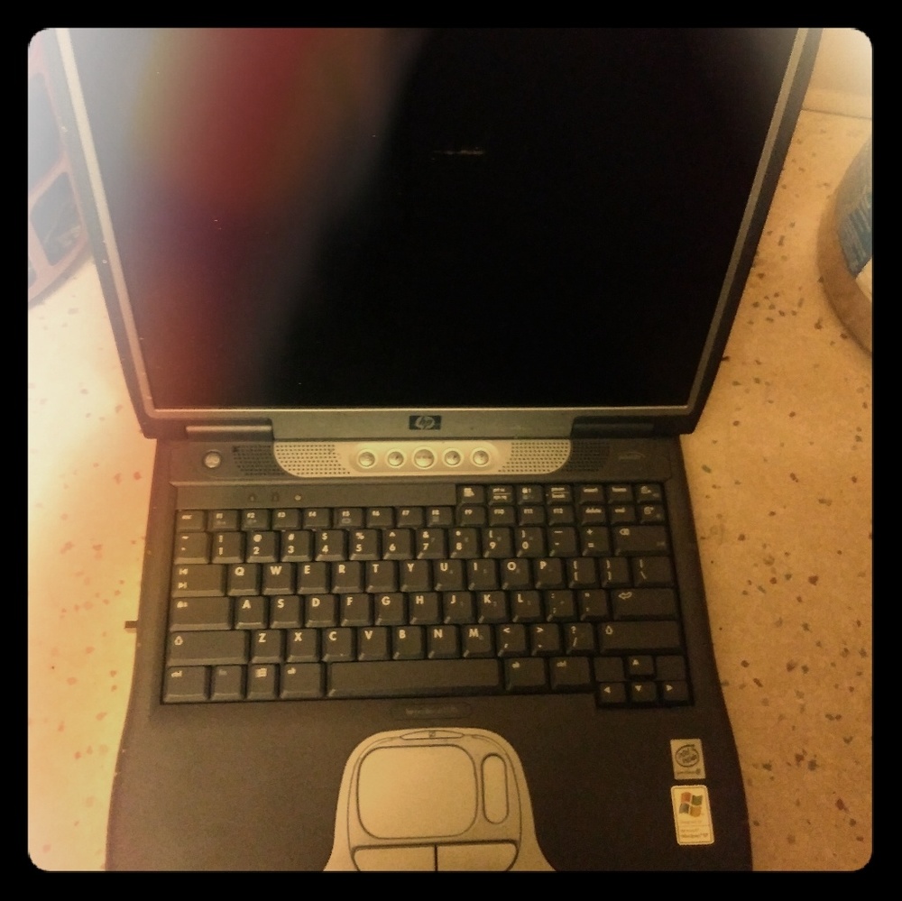 cellphone cracked screen and two laptops